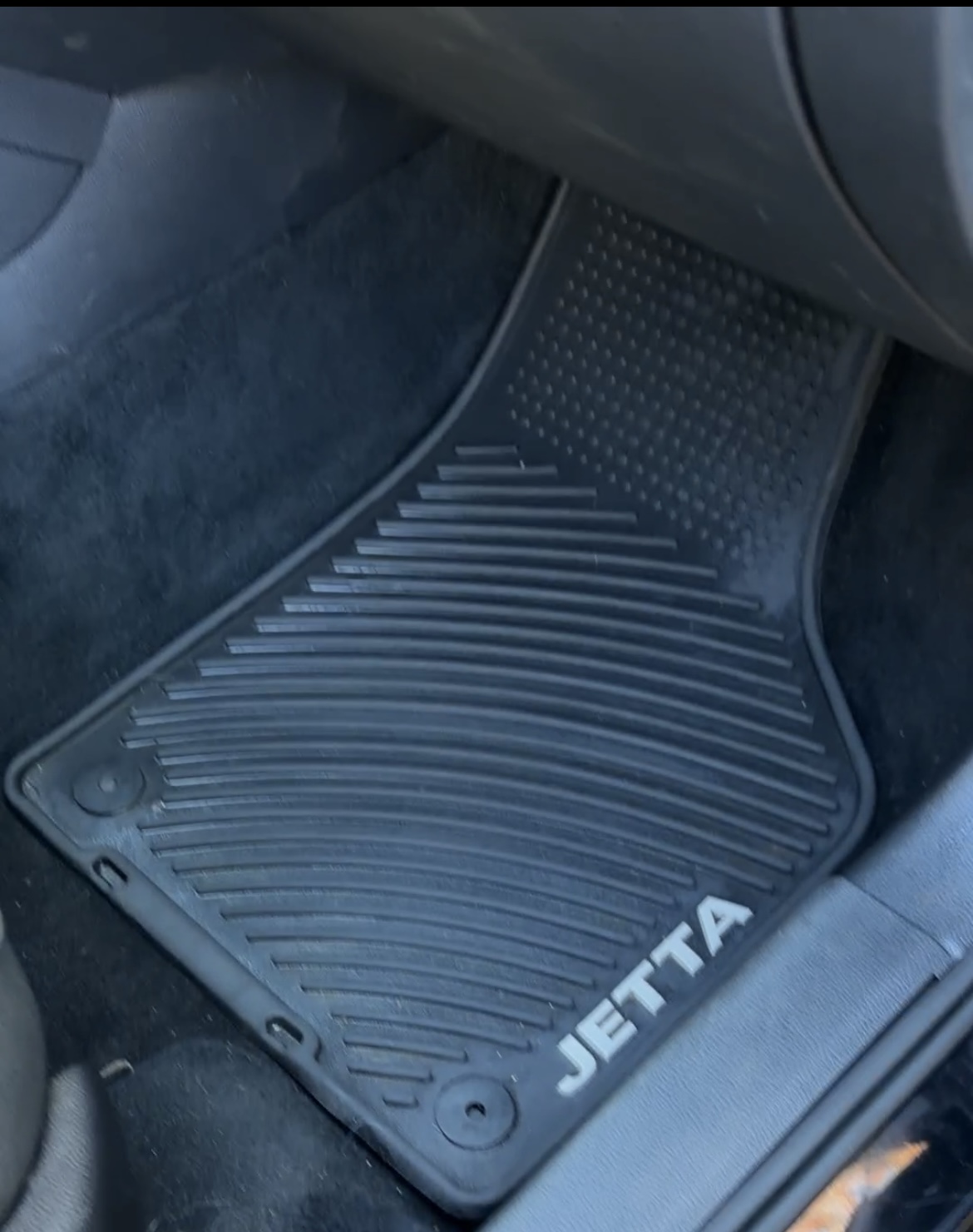 The same Jetta floor mat after an interior detail